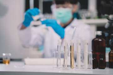 Food scientist testing milk samples of dairy products in the laboratory. Researchers are looking at...