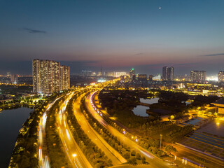 Fototapeta na wymiar Hanoi skyline cityscape at sunset on Thang Long avenue, Tu Liem district
