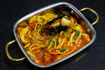 seafood linguine pasta with tomato sauce and shrimps, mussels, scallop, clams