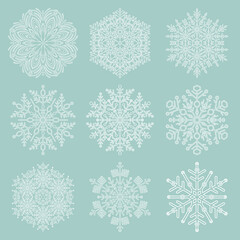 Set of snowflakes. Light blue and white winter ornaments. Snowflakes collection. White snowflakes for backgrounds and designs