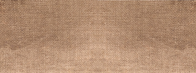 Rural texture of sackcloth. Background of very coarse, rough fabric woven made of flax, jute or hemp. Burlap bag material. Design element. Sacking and bagging pattern. Top view.