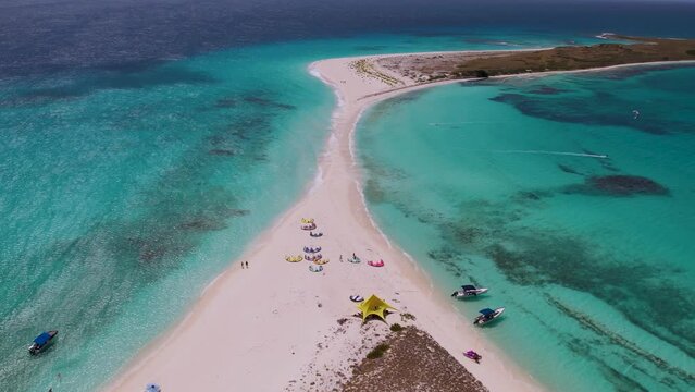 aerial view tilit up sandbank with kites lying on sand beach, cayo de agua tropical island