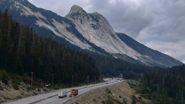 Coquihalla Highway Mountain Journey: Heavy Duty Bulldozer Haul with Zopkios Peak in the Background
