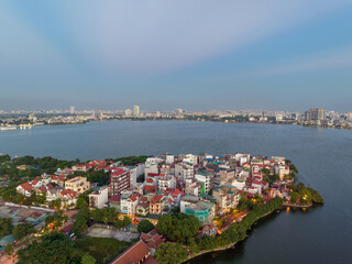 Naklejka na ściany i meble Hanoi skyline cityscape in Ho Tay West Lake with lake and city buildings