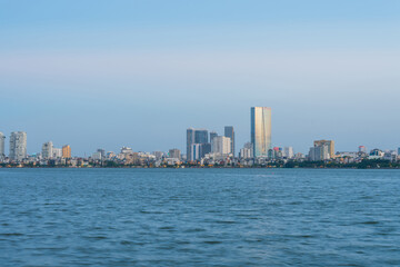 Hanoi skyline cityscape in Ho Tay West Lake with lake and city buildings