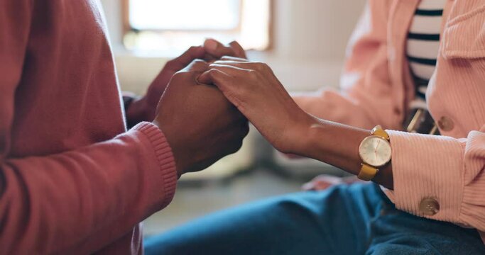 Man, woman and holding hands in trust with support in home for understanding with health in closeup. African people, married and love in relationship by care for bond, strength or faith with wellness