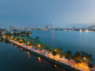 Hanoi skyline cityscape in Ho Tay West Lake with lake and city buildings