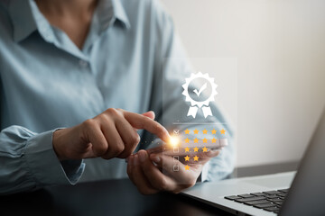 customer satisfaction survey concept businesswoman use smartphone Touch the happy smiley icon. Satisfied. 5 stars. Service experience rating. online application Satisfaction Review best quality.