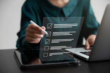 Business performance monitoring concept, businesswoman using laptop and tablet Online survey filling out, digital form checklist.