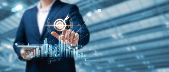 Business goal success concept, businessman touch symbol of digital marketing and target of...