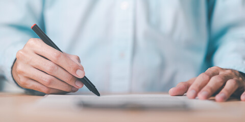 Businessman checking contract documents ,handle business documents and agreements ,Business contract signing ,business cooperation ,Signing to approve contract or warranty documents