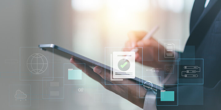 Accountant showing office document auditing concept ,plan review process and assess correctness ,Management of important document storage of organization ,document system ,accountant Audit documents.