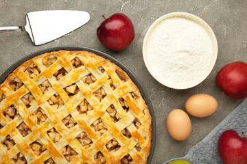 Cooking baking concept. Making American apple pie on table with ingredients