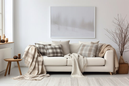 White cozy sofa with pillows and plaid. Scandinavian home interior design of modern living room.