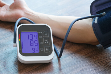 Men's health check blood pressure.and heart rate with digital pressure gauge  standard blood pressure test results .Health and Medical concept - obrazy, fototapety, plakaty