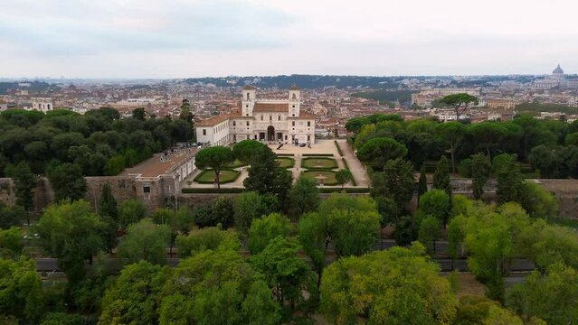 Aerial view of Villa Medici and its Italian garden in Rome (capital of Italy) contiguous with the larger Borghese gardens. Dolly move.