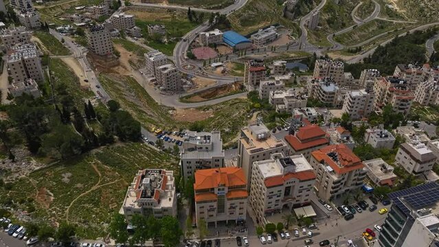 Fly Over Urban Buildings And Roads At Ramallah Town In The West Bank, State Of Palestine. Aerial Shot