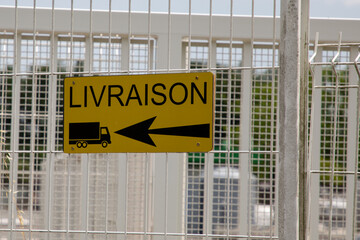 French sign livraison means delivery and arrow sign truck