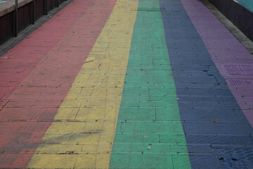 Pedestrian lgbt+ paint floor town street colours crossing pedestrian pathway marking in LGBT color...