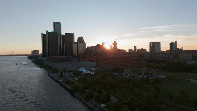 Drone shot of the city of Detroit. Central Business District and Detroit river at Evening Time. 