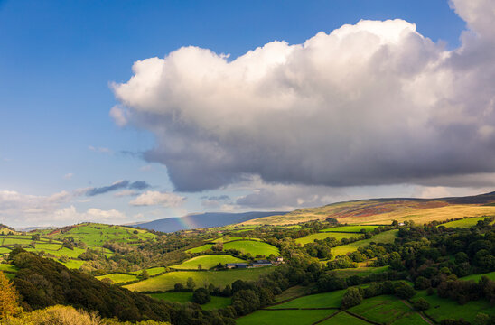 The dramatic castle ruins of Carrag Cennen located on top of a rocky hill in the Carmarthenshire countryside Wales UK