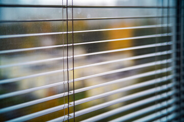 open steel blinds on the window