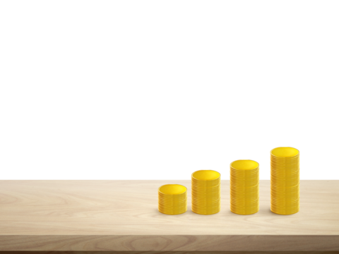 Stacks of gold coins in a row on a wooden table Isolated PNG transparent