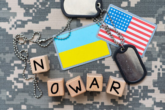 Ukrainian army flag patch and military ID tags on camouflage uniform no war