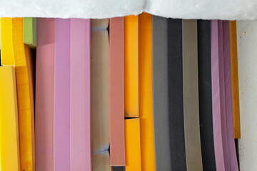 Stacked sheets of foam rubber for furniture production in factory workshop