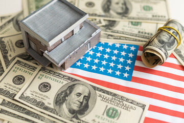 Small Model House on Layer of One Hundred Dollar Bills.