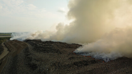 Flying a drone over a fire that occurred at a landfill on the island of Bali. Plastic waste is...