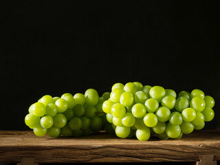 shine Muscat, green grapes on a wooden tray	