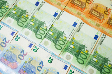 big stack of euro money on wooden background. money cash