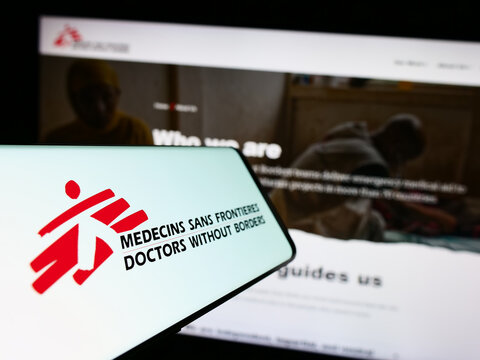 Stuttgart, Germany - 10-06-2023: Cellphone with logo of charity organization Doctors Without Borders in front of website. Focus on center-left of phone display.