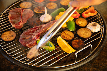 Roast steak with vegetables on the grill
