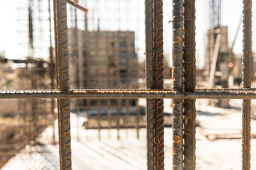 Close-up of iron rods used for reinforcement of concrete building on construction site