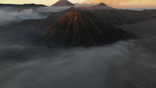 Aerial view of Bromo, Batok and Semeru volcanoes at sunrise, Java, Indonesia
