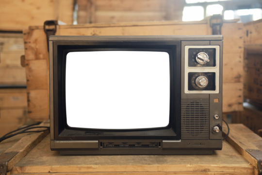 Old TV with a white screen on the bedside table. Retro technology concept.