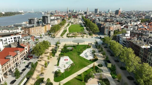 Drone flyover park in zuid District of Antwerp with schelde river during sunny day