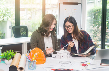 Architectural woman designer making digital building plan for professional construction renovation in office.