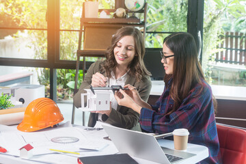 Architectural woman designer making digital building plan for professional construction renovation in office.