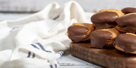 Chocolate cookie. Chocolate chip cookies baked with almond flour on a wooden background. patisserie products. Copy space