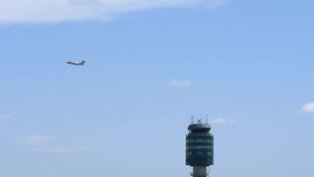 Airport Scene with Aircraft Flying Behing Air Traffic Control Tower 4K
