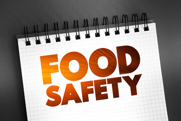 Food Safety text quote on notepad, concept background