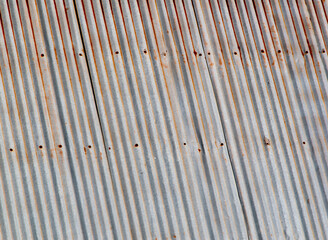 background The surface of the old zinc roof has rust.