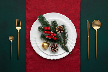Festive table setting, christmas decoration. Dishware, golden cutlery. Celebration xmas eve:...