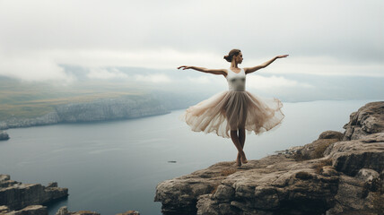 beautiful ballerina in a white dress on a rock in the mountains