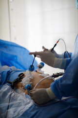 hands of doctors performing laparoscopy operations