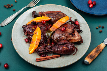 Baked chicken legs, drumsticks in wine sauce.