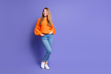 Fototapeta na wymiar Full length portrait of adorable minded girl put hands pockets look empty space isolated on purple color background